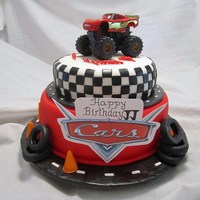 Cars Themed Birthday Cake This Cars themed cake was created for a special birthday boy. The inside of the bottom tier when cut was checkered with chocolate and...