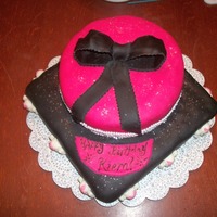 Girly Skulls covered in fondant, top tier is a ribbon of edible pears and bottom tier has skulls I made with Candy Melts and the Skull/Treasure chest...