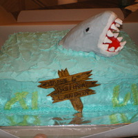 Shark Cake Chocolate cake, buttercream icing, rice crispy shark covered with icing, gumpaste wooden sign