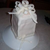 My Mom's Birthday Cake This is the birthday cake I made for my mom this year. It was my first attempt at fondant (poor thing was my guinea pig, but she loved it...