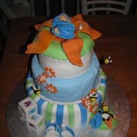 Baby cake that i made for one of my friend can be use for shower are baptism. The cake toppers the shoes, bee and flower are gum paste and cake...