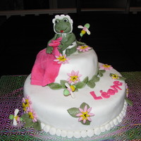 Baby Frog Vanilla cake with buttercreme icing convered with mmf fondant. Frog and others thing are gumpaste