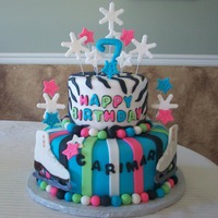 Ice Skates Top tier is vanilla with chocolate buttercream. Bottom tier is chocolate with cookies & cream buttercream. Ice skates are hand painted...