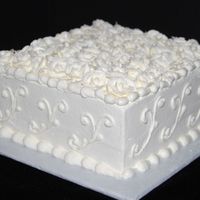White Roses 8" white cake with white buttercream. The roses are also buttercream. This is actually a thank you cake for a friend, but the wedding/...
