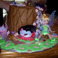 Tinkerbell At Home tree stump cake with gp flowers and lady bugs