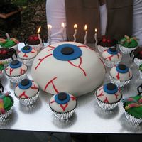 Science Theme Birthday Cakes - Eyeballs, Worms And Spiders! These were the cakes I did for my son's 6th Science birthday party. The main cake was an eyeball cake, and the cupcakes were eyeballs...