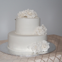 Two Tier White Wedding Cake With Open Roses Very simple cake but it's what the bride wanted. This was my first attempt at an open rose. So let me know what you think, and feel...
