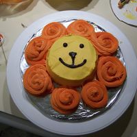 Lion's Head Individual cake made for my nephew's 1st birthday. 4 in. round cake with icing swirls for the mane.
