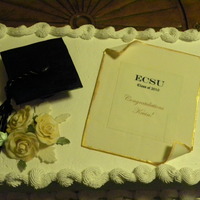 Graduation Cake For My Nephew WASC cake with cheesecake mouse and fresh strawberries filling and whipped cream frosting. Gumpaste Graduation Cap, Diploma and Roses.