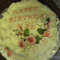 Mom's Birthday Cake! Lemon cake with raspberry mouse filling, buttercream frosting and gumpaste flowers.