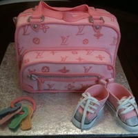 Diaper Bag Cake Chocolate cake with buttercream frosting. Used 12x12 cake pans then stacked and doweled. Covered with fondant. Handpainted logo. All...