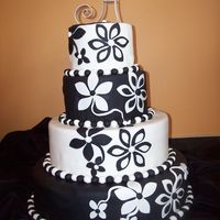 Fondant Flower Fun This cake says it all.....................Simply Fun!!!! Brides are loving the flowers and also adding a bit of color like lime green and...