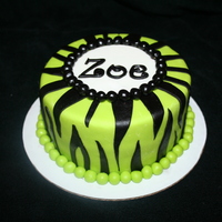 Lime Green Zebra Stripes 6in chocolate cake covered in fondant. Candy zebra striped sucker.