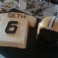 Saints Birthday Saints Jersey is yellow cake with buttercream icing. Saints Helmet is chocolate cake, chocolate buttecream, and covered in fondant.