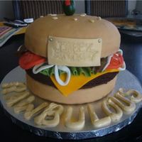 Cheeseburger Cake my first 3d cake! bun is white cake & patty is a brownie! yummm