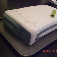 Xbox Cake here is a 2 layer xbox cake.. white cake with cookies n cream filling and chocolate fudge buttercream =)