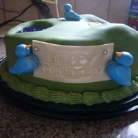 Golf Birthday Cake "birdie On The Hole" i made a bird and put it on the hole.. "birdie on the hole"! thanks hallmark! haha