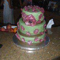 Friends Birthday Cake A three tiered cake covered in fondant w/ an anenome flower and petals. Started out perfect I waas sooo happy with it!! Then it came time...