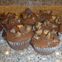 Peanut Butter Choc. Cupcakes Choc. cupcakes w/ peanut butter filling, choc. buttercream and topped with Reeses!! Yummy!!TFL