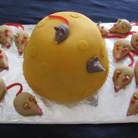 Image002.jpg I made this cake for the children at my church. Cake was made in a large Pampered Chef batter bowl... (to look like a hunk of cheese). The...