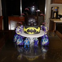 The Mask Of Batman 2 tier chocolate buttercream cake with gumpaste mask and fondant accents. The little boy I made this for actually got the flu the day of...