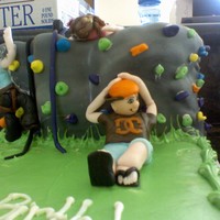 Rock Climbing Made with fondant. It was my first cake that I made people for. I was pretty tough.