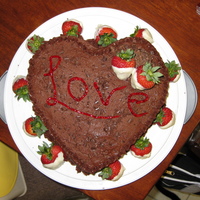 3Rd Anniversary Cake Chocolate cake with cherry filling and chocolate buttercream. Chocolate dipped strawberries on the side.