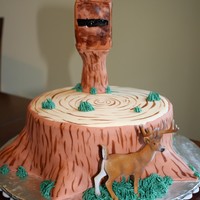 Hunting Cake Almond cake with almond bc and mmf. The deer stand is rice krispie treats covered with fondant.