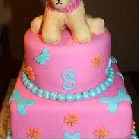 Webkinz Cake This is a cake I made to match a little girls golden retriever webkinz. The dog is made out of rice krispie treats covered with mmf.