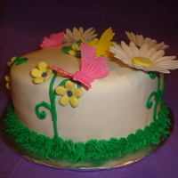 Birthday Cake For An 11 Year Old Girl I made this for an 11 year old girl who loves nature. I made the butterflies using a cutter and the daisies were made of gum paste.