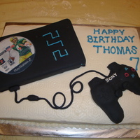 Playstation 2 Cake I made this cake for my 7 year old's birthday. The game on top was printed on edible paper, and the controller was made out of Rice...