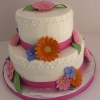 Gerber Daisy Wedding Cake 2-tier gluten-free chocolate cake with vanilla BC, gumpaste gerber daisies and hydrangeas. I used this tutorial ( http://www.make-fabulous-...