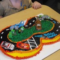 Pixar Movie Car Race Track Birthday Cake This is a Pixar Movie Car Race Track Birthday Cake. My three year old grandson Christian wanted the Pixar Movie Cars racing on his cake....