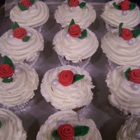 Red Rose Cupcakes Funfetti cupcakes, frosted with vanilla butter cream and topped with fondant red rose and pearl colored chocolate candies