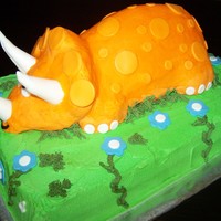 Orange Triceratops Cake Triceratops Cake made for a 4 yr old dinosaur fan. Cake is Funfetti with vanilla butter cream filling tinted orange like the triceratops....