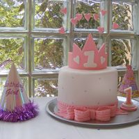 Princess Cake Made for my daughter's first birthday. Only my second time using fondant! Vanilla cake with white chocolate ganache. Fondant crown,...
