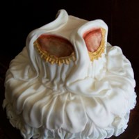 Romantic Allure This is a red velvet cake using fondant to create the effect of draped fabric. The top tier is hand sculpted and painted. The trim is hand...