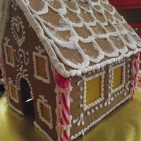 Gingerbread House Less Is More I designed 4 types of gingerbread houses, candle holders, and purses this year and this house was by request. The client aid she wanted a...