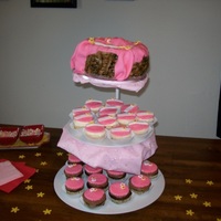 Client Called This "moses Basket" This is a chocolate cake dense enough to carved and then basket weave fondantis surrounding the cake with pink fondant fabric laid over top...