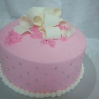 16Th B-Day Chocolate cake filled with raspberry buttercream, iced on buttercream with a gumpaste bow. Thanks for looking!!!