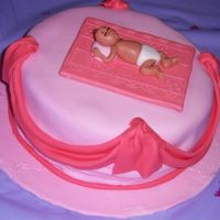 Baby Sleeping Coconut cake filled with cream cheese and pineapple covered in MMF. Baby is also made out of MMF (1st time making it).