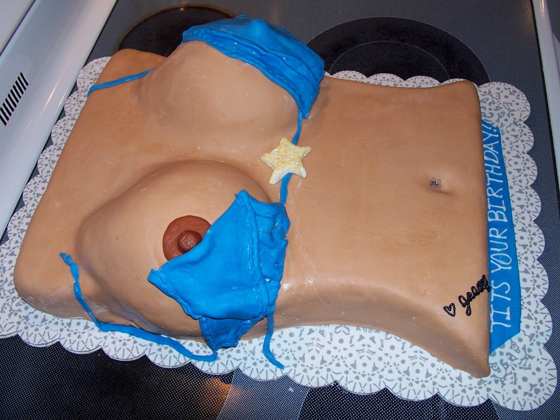 Peek -A-Boo Boobie Dirty 30 Birthday cake - base covered in Buttercream and then top was covered in tinted Marshmellow Fondant, swimsuit is also MMF.
