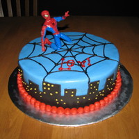 Spiderman Cake Chocolate cake with buttercream frosting, fondant accent, and a spiderman toy for the top. Thanks CC decorators for the help, and the ideas...