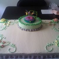 Tinkerbell this cake was made for a 2 yr old girl.This is a full sheet cake. half yellow, half chocolate, all iced in butter cream icing
