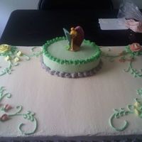 Baby Karina Full sheet cake half yellow, half chocolate, top cake is yellow, all butter cream icing. this one i tried with a Tinkerbell candle.