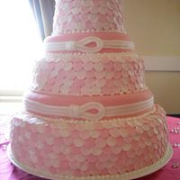 Fondant Polka Dot Wedding Cake This is my first completely covered fondant cake I've done. The double layers were strawberry/white cake swirl, and the single layers...