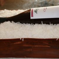 Wine Bottle In Crate Almond flavored sugar wine bottle with fondant seal and non-edible label. White chocolate pound cake, strawberry butter cream and...