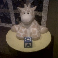 "stuffed" Giraffe And Baby Block A replica of a stuffed giraffe as a cake with a baby block for a work baby shower. Thank you tonicake for the idea!