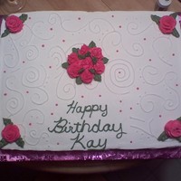 Kay's B-Day Cake 11x15 sheet cake. 1/2 WASC & 1/2 best darn chocolate cake. vanilla buttercream. first time with scroll work and my BC roses are finally...