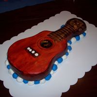 Guitar Cake I cake I made for my dads 60th Birthday party. Vanilla with buttercream icing, and fondant.
